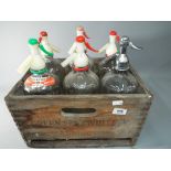 Breweriana - a wooden crate with six soda siphons.