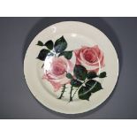 A plate decorated in the Cabbage Rose pattern,