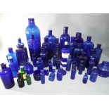 Breweriana - a large quantity of predominantly cobalt blue vintage glass bottles.