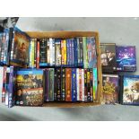 A lot to include a box of DVDs and Blu-Ray discs comprising feature films, series and similar.