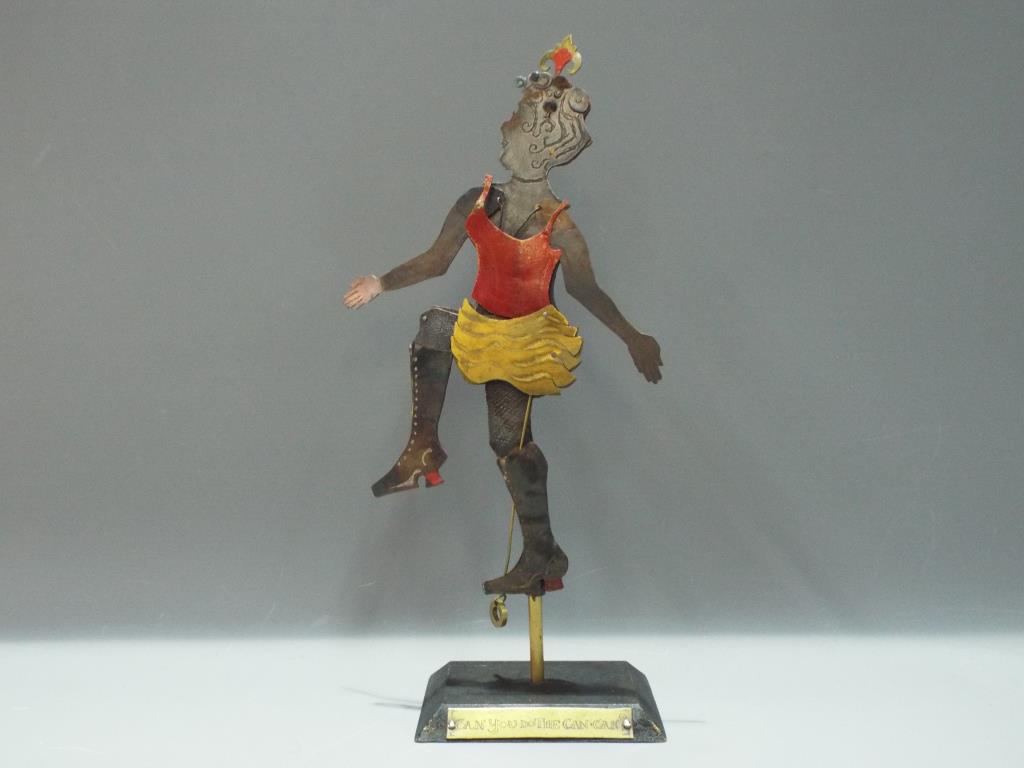 An articulated metal model, depicting a Can Can dancer on stand, approximately 30 cm [h].