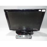 A Panasonic Viera 19" LCD television model TX-L19X10B with remote control.