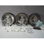 A quantity of paperweights predominantly depicting animals,