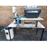 A bench mounted Axminster band saw, model #JBS125,