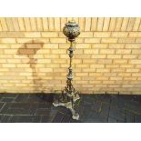 A large decorative lamp base approximately 120 cm [H].