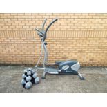 A HEalthy Living Cross trainer with digital display with a set of weights [2].