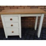 A modern dressing table with natural wood surface, approximate height 77 cm x 107 cm x 49 cm.
