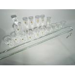 A lot to include two glass walking canes, a quantity of crystal drinking glasses,