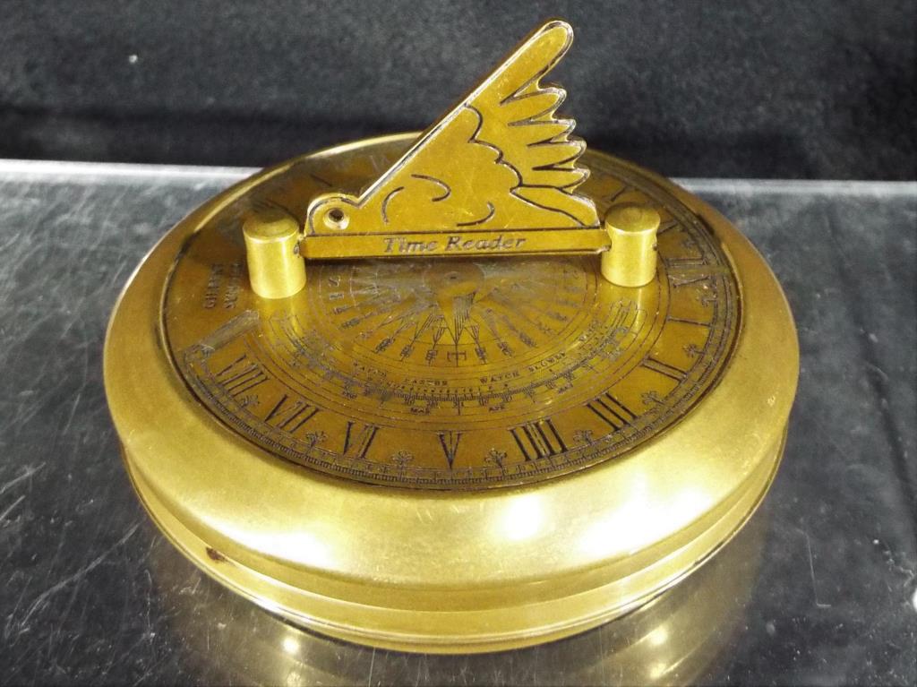 A portable brass sundial / compass scribed 'Gilbert' approx 7.