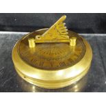 A portable brass sundial / compass scribed 'Gilbert' approx 7.