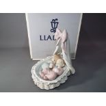 Lladro - a ceramic Lladro figurine entitles Sweet Dreamers with certificate of authenticity in