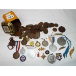 A good mixed lot of coins and commemorative medals, enamelled pin badges,