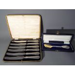 A cased set of six silver handled butter knives Sheffield assay,