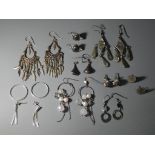 Ten pairs of silver earrings