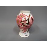 Moorcroft - a Moorcroft Confetti vase signed by E. Bosson's to the base, approximately 17 cm height.