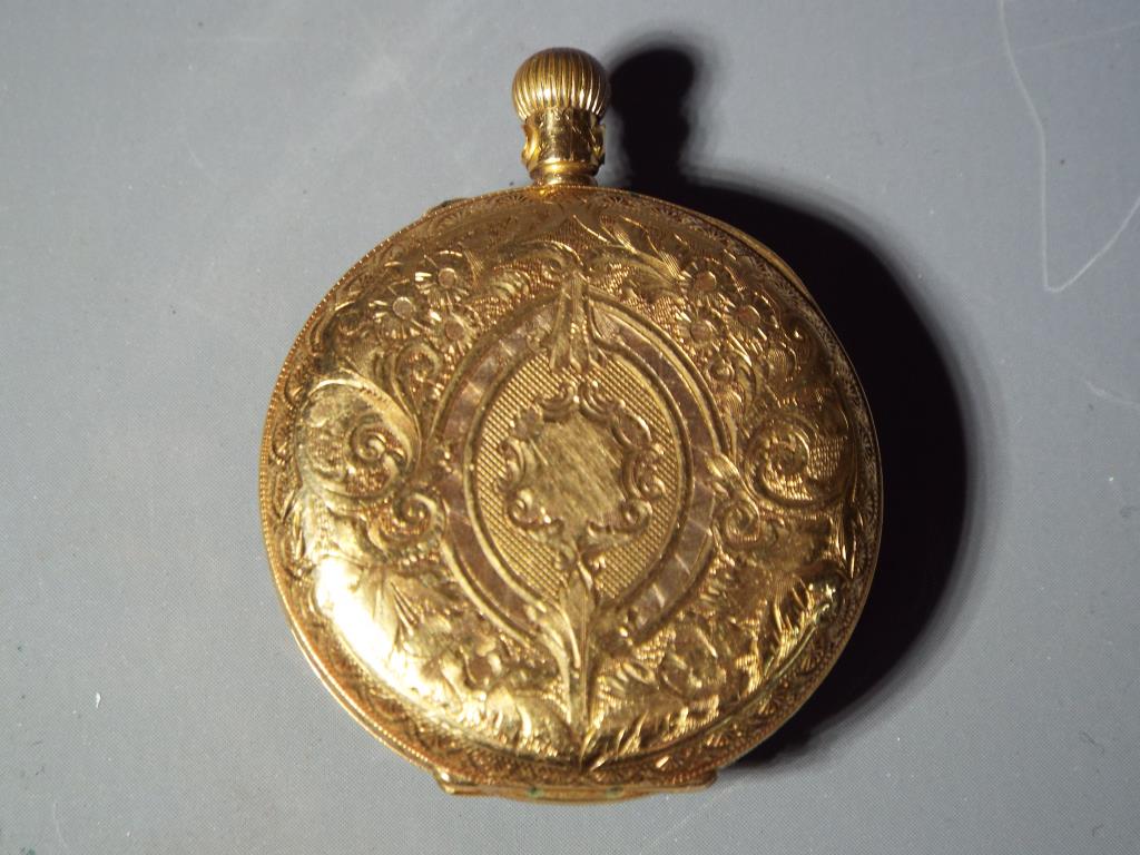 A lady's 18 carat gold pocket watch, the case with foliate and floral engraving, - Image 2 of 5