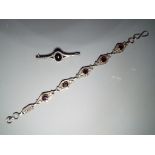 A bracelet stamped 925 comprising five stone set links and a stone set bar brooch stamped Sterling.