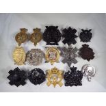 A collection of military cap badges to include Galloway Rifle Volunteers, Scottish Horse,