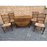 An oak drop-leaf table with four 'Liverpool' fan / shell back dining chairs,