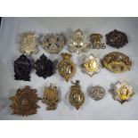 A collection of military cap badges to include Galloway Rifle Volunteers,