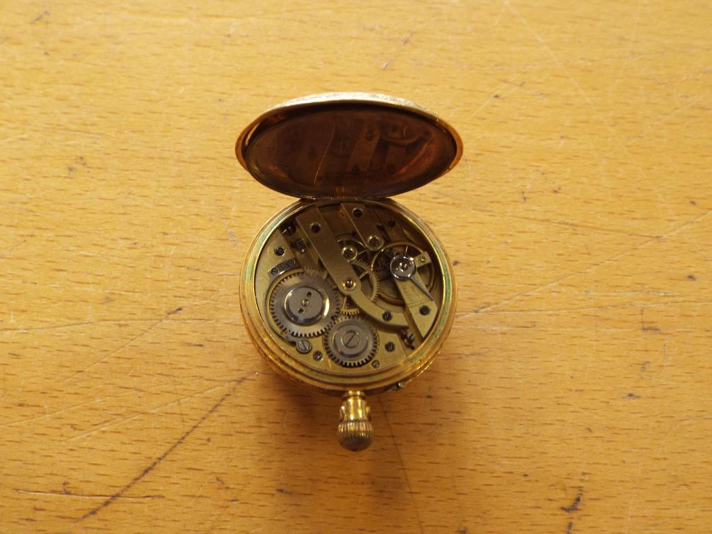 A lady's 18 carat gold pocket watch, the case with foliate and floral engraving, - Image 5 of 5