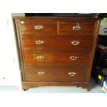 A good quality oak chest of draws two over three with brass handles set on castors,
