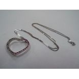9 CT - a 9 carat white gold fine diamond cut curb chain with a 9 carat gold stone set heart shaped