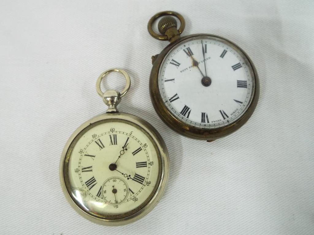 Two pocket watches, the first a white metal cased example, Roman numerals to the dial,