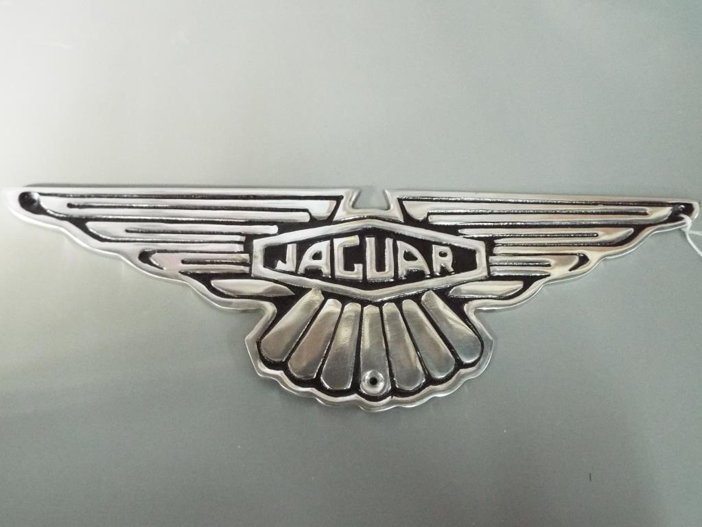 A chrome Jaguar sign, approximately 39 cm [w].