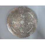 A Cairoware copper and silver inlaid plate with deer and scrolling foliate decoration,