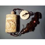 Netsuke - a vintage Japanese bone inro, depicting a gentleman on both sides,