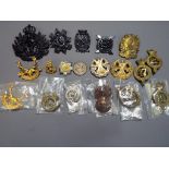 Eighteen assorted British Army cap badges