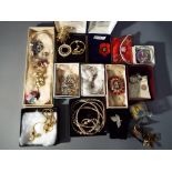 A good mixed lot of costume jewellery to include brooches, double stranded graduated pearl necklace,