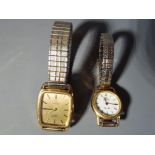 Two yellow metal, quartz Omega De Ville wrist watches with expanding straps.