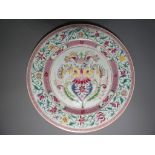 A hand painted plate with floral decoration approximately 23 cm [d],