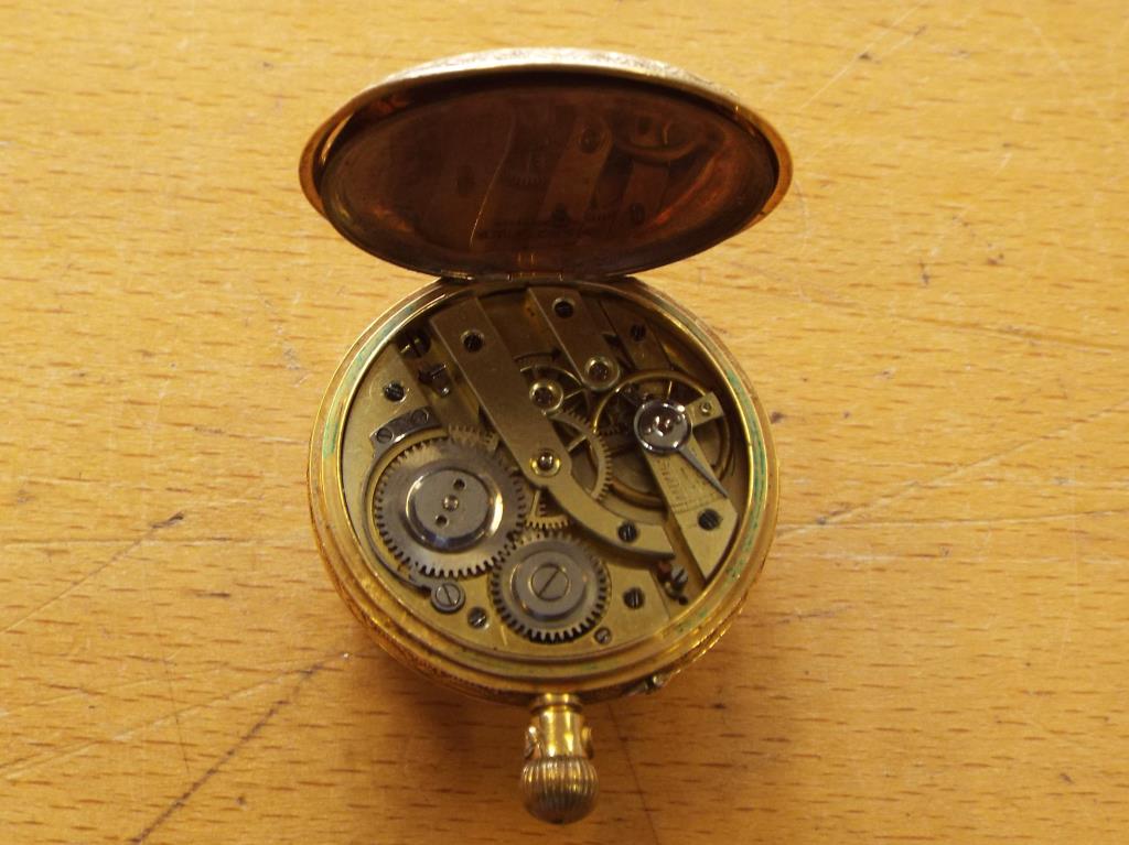 A lady's 18 carat gold pocket watch, the case with foliate and floral engraving, - Image 4 of 5