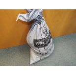 A heavy sealed sack of unsorted costume jewellery approximately 26.9 kg total weight.