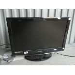 A Technika 21.6" LCD television with remote.