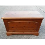 A wooden storage chest approximately 52 cm x 80 cm x 37 cm.
