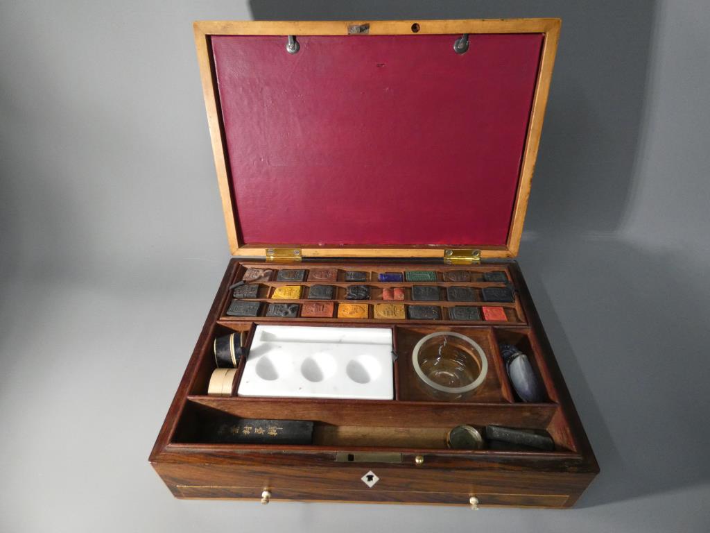 A 19th Century artist's box with inlaid decoration with fitted interior containing watercolour