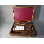 A 19th Century artist's box with inlaid decoration with fitted interior containing watercolour
