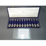 A cased set of twelve sterling silver Zodiac spoons in fitted case by David Cornell,