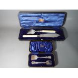 An Edward VII silver hallmarked cake set Sheffield assay 1906 contained in fitted case and a George