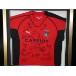 A framed Coventry City Football Club shirt bearing signatures, approximate size 64 cm x 64 cm.