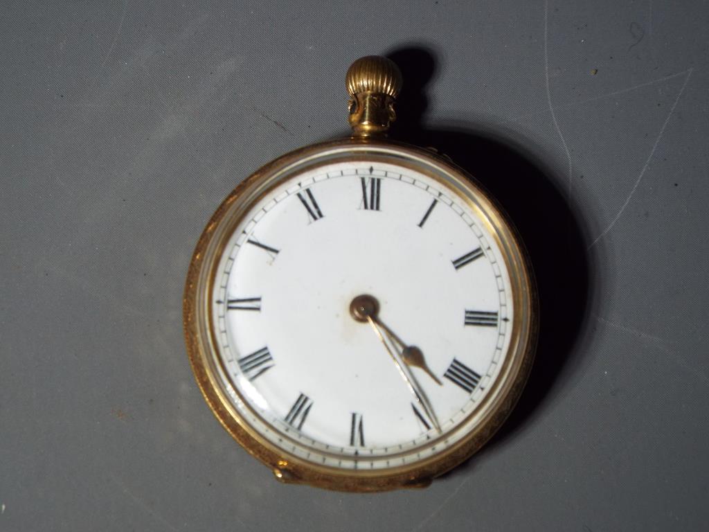 A lady's 18 carat gold pocket watch, the case with foliate and floral engraving,