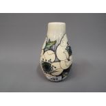 Moorcroft - a Moorcroft Snowsong vase, approximately 14 cm height.