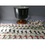 A Zoetrope or Wheel of Life on a turned wooden base with eleven paper animation panels [3 ripped],