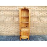 A tall pine display cabinet two shelves over one cupboard, approximately 186 cm x 61 cm x 37 cm.