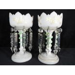 A pair of decorative glass centrepieces with applied snake decoration to the stem,