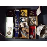 A good mixed lot of costume jewellery to include brooches, a white metal filigree necklace,